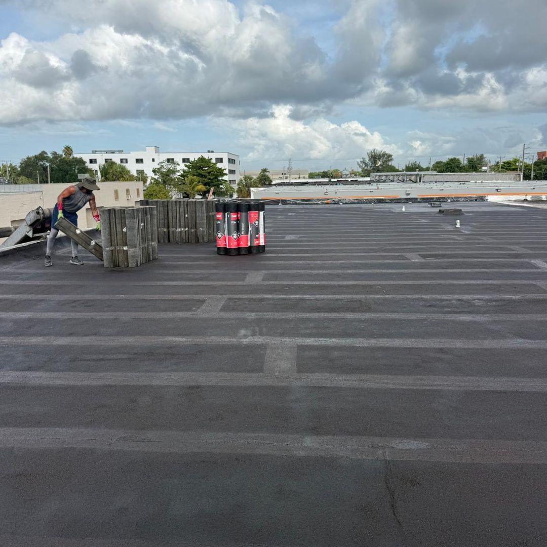 Roofing materials staged on a commercial roof